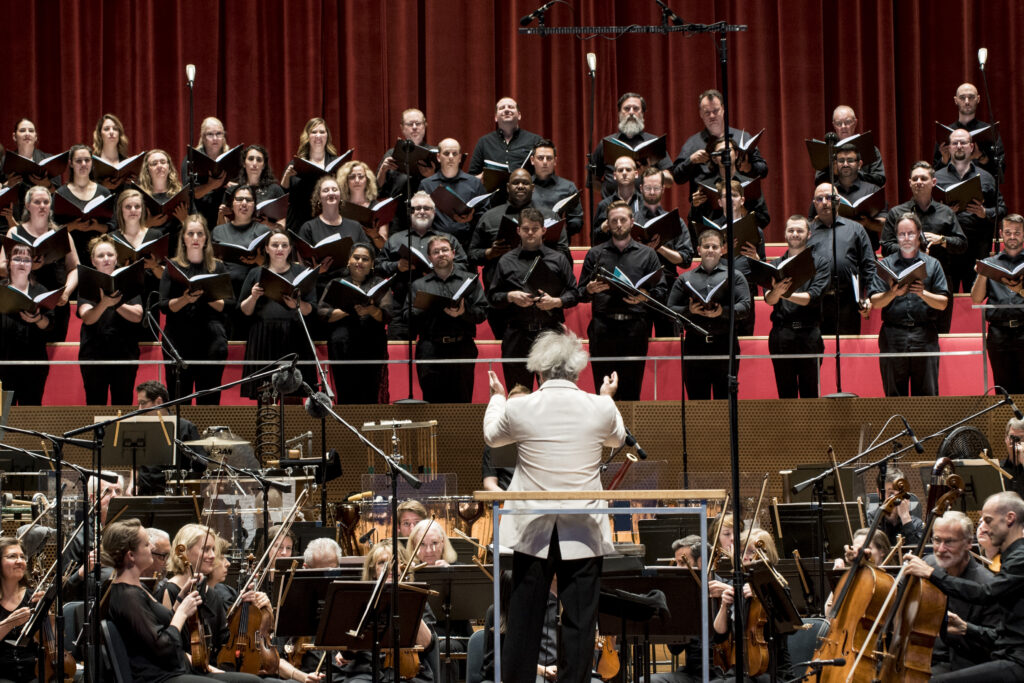 Carlos Kalmar conducts the Grant Park Orchestra and Chorus in the Grant Park Music Festival's world premiere of Kareem Roustom's Turn to the World: A Whitman Cantata, June 14, 2019, Jay Pritkzer Pavilion in Millennium Park